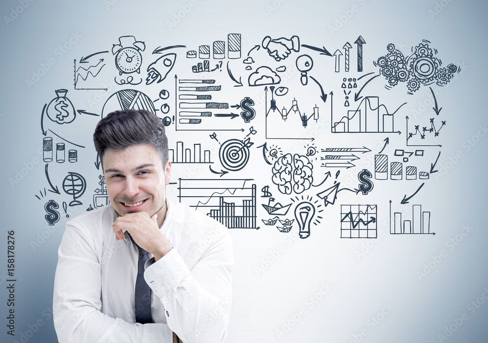 Cheerful businessman and his business scheme Cheerful businessman and his business scheme