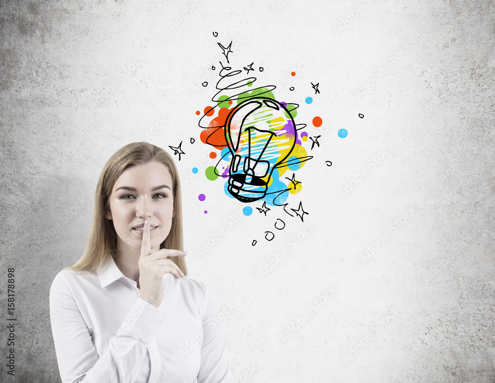 Blond woman making a hush sign, light bulb