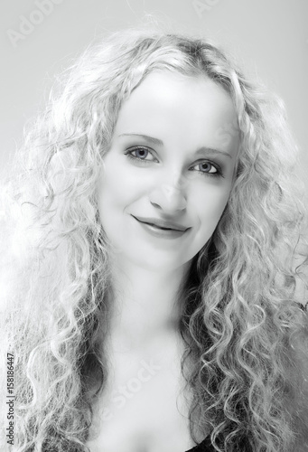 Fototapeta Naklejka Na Ścianę i Meble -  Portrait of a Young Woman with Blond Hair