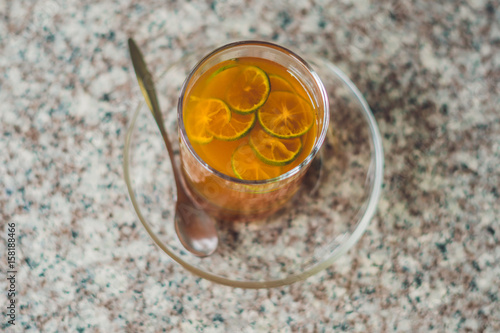 Tangerine tea on a table in a cafe photo