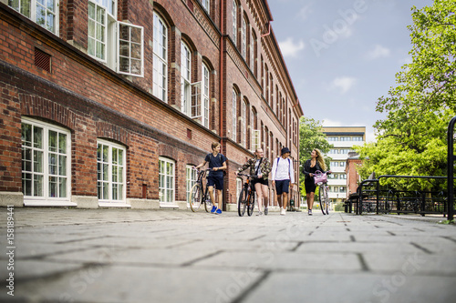 Students (14-15) walking by school