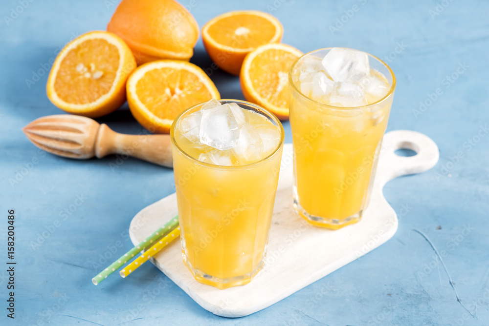 Glass of orange juice with ice cubes Cold orange fresh Glass of orange juice  for hot summer day Stock Photo | Adobe Stock