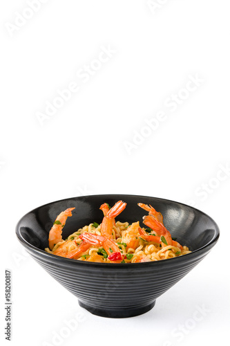 Noodles and shrimps with vegetables in black bowl isolated on white background

