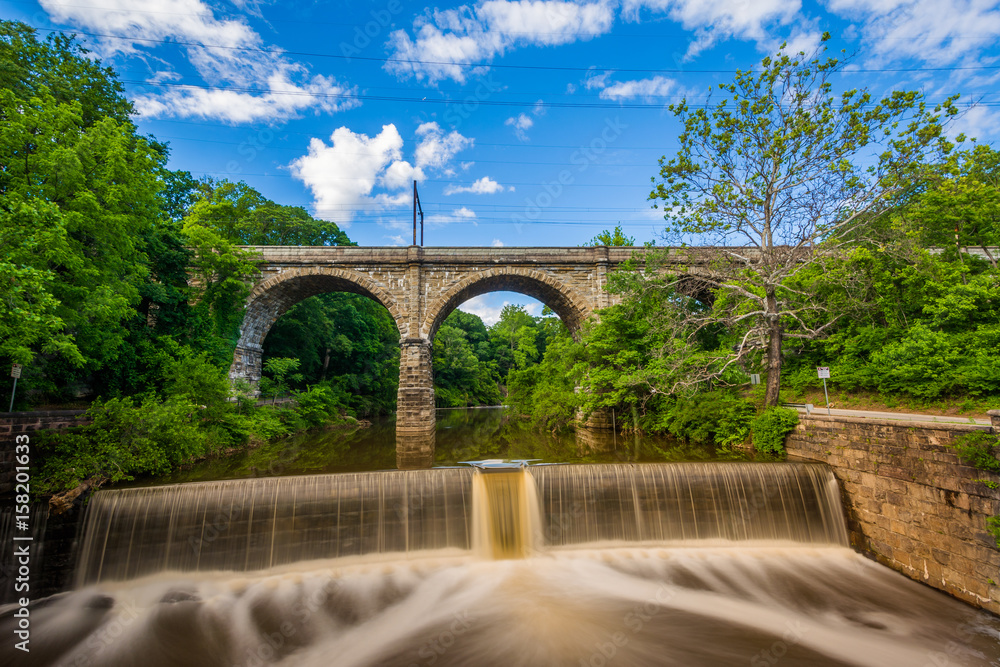A dam on Wissahickon Creek and old railroad bridge, in Philadelphia, Pennsylvania.