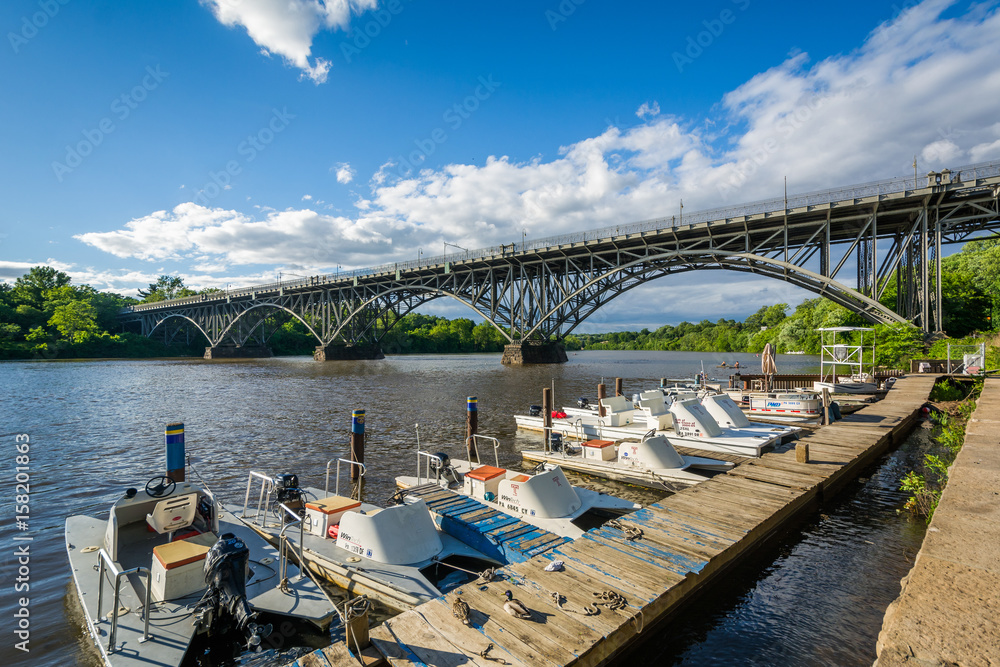 Boats and the Strawberry Mansion Bridge over the Schuylkill River, at Fairmount Park in Philadelphia, Pennsylvania.
