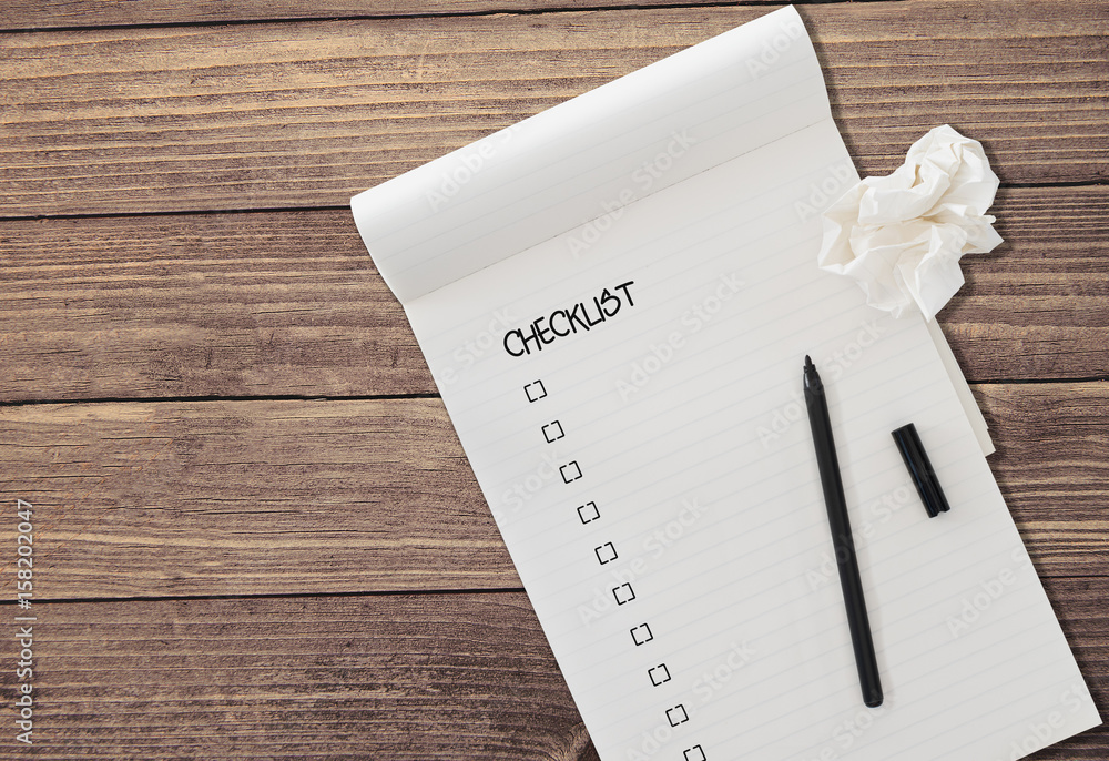 Obraz na plátně ruled notepad with word CHECKLIST and check boxes with black felt tip pen and a