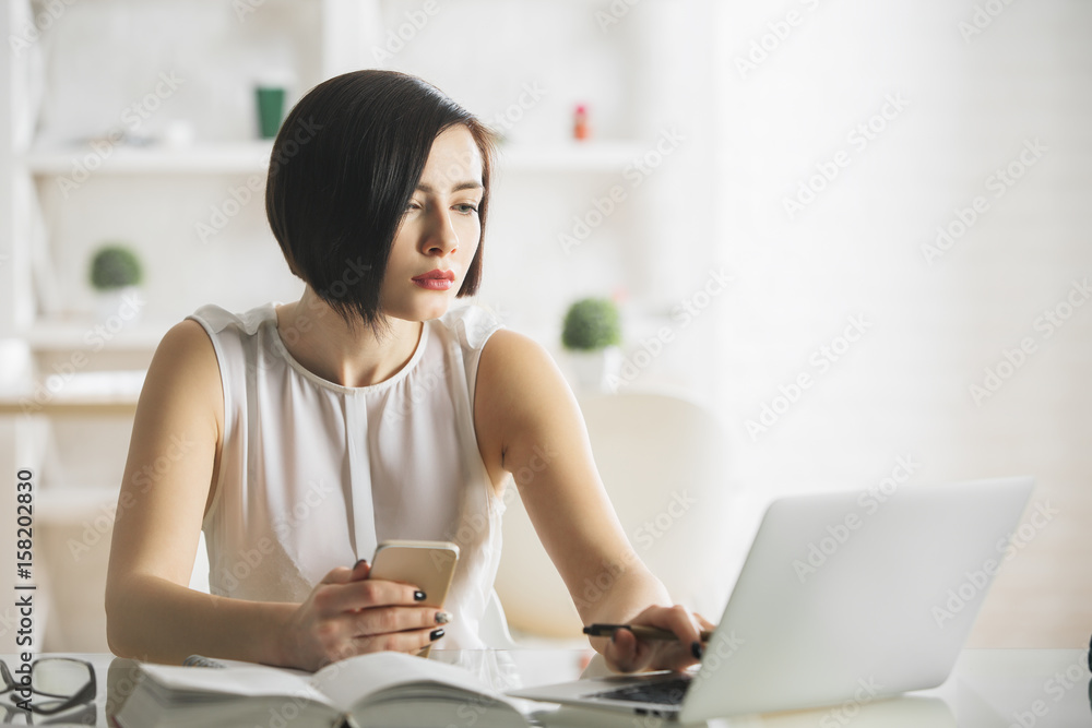 Pretty businesswoman using technology Pretty businesswoman using technology
