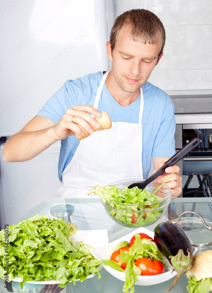 man cooking salad