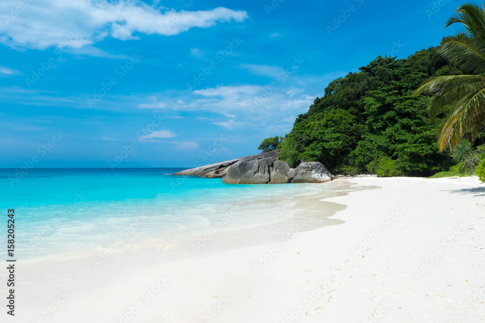 Beautiful view with blue sky and clouds, blue sea and white sand beach on Similan island, No.8 at Similan national park, Phuket, Thailand is most popular vacation for tourist.
