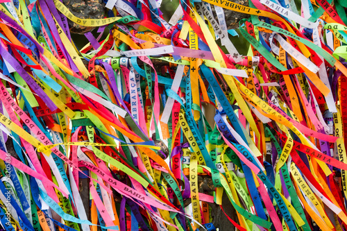 Colored ribbons tied in the grate of the Church of Our Lord of Bonfim in Salvador, Brazil photo