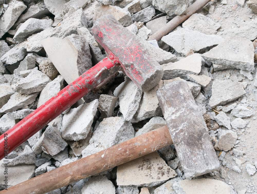 Hammer with broken bricks and concrete Hammer with broken bricks and concrete