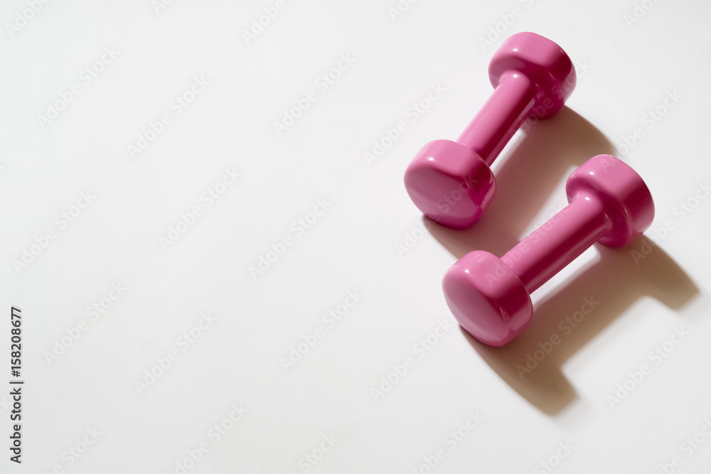 Pink dumbbells on White Pink dumbbells on White
