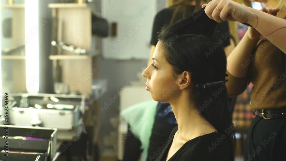 creating hairstyles hairdresser at salon. indoor shot creating hairstyles hairdresser at salon. indoor shot