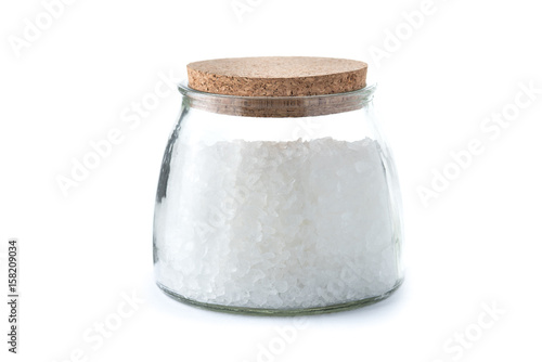 Fotografie Glass jar with rock sugar isolated on white.