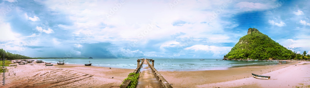 Panorama, scenery with islands and jetty stretching out to sea with blue skies, beaches, turquoise sea; places at Thamthong Bay, Pathiu District, Chumphon, Thailand