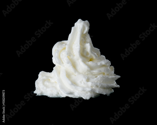 whipped cream on a black background