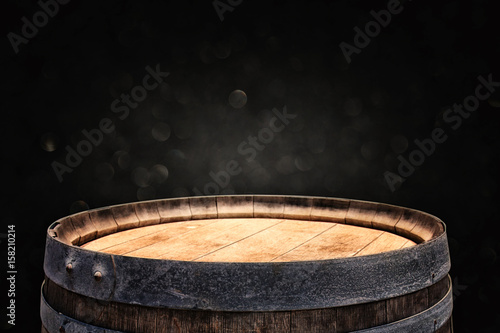 Stampa su tela Image of old oak wine barrel in front of black background