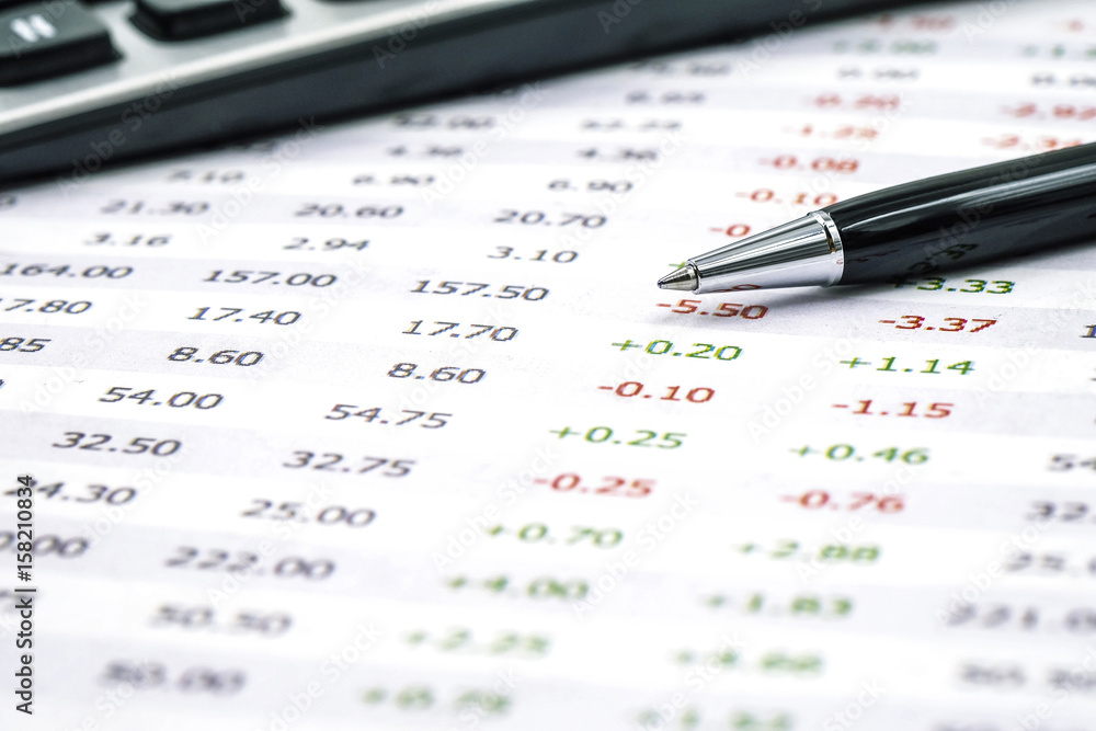 Accounting and finances with pen and calculator Accounting and finances with pen and calculator