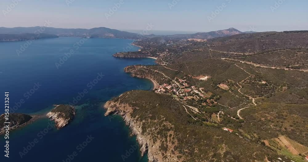 Aerial shot of a beautiful Elba island with its gorgeous paradisiac sea in Tuscany, Italy, 4K Aerial shot of a beautiful Elba island with its gorgeous paradisiac sea in Tuscany, Italy, 4K