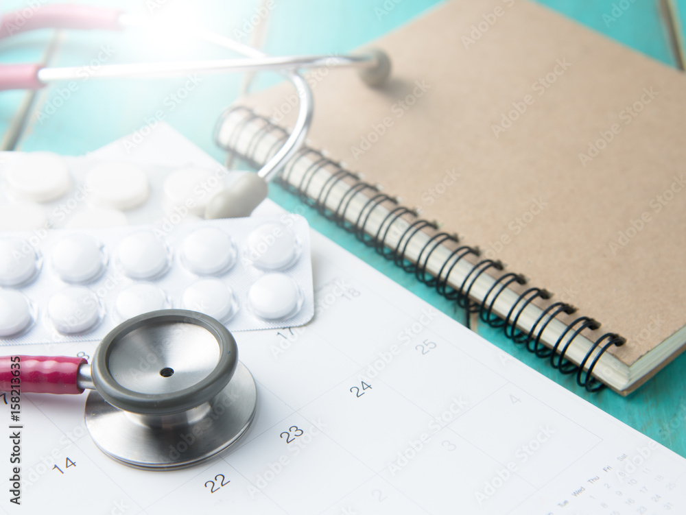 stethoscope and drugs on calendar, medical concept stethoscope and drugs on calendar, medical concept
