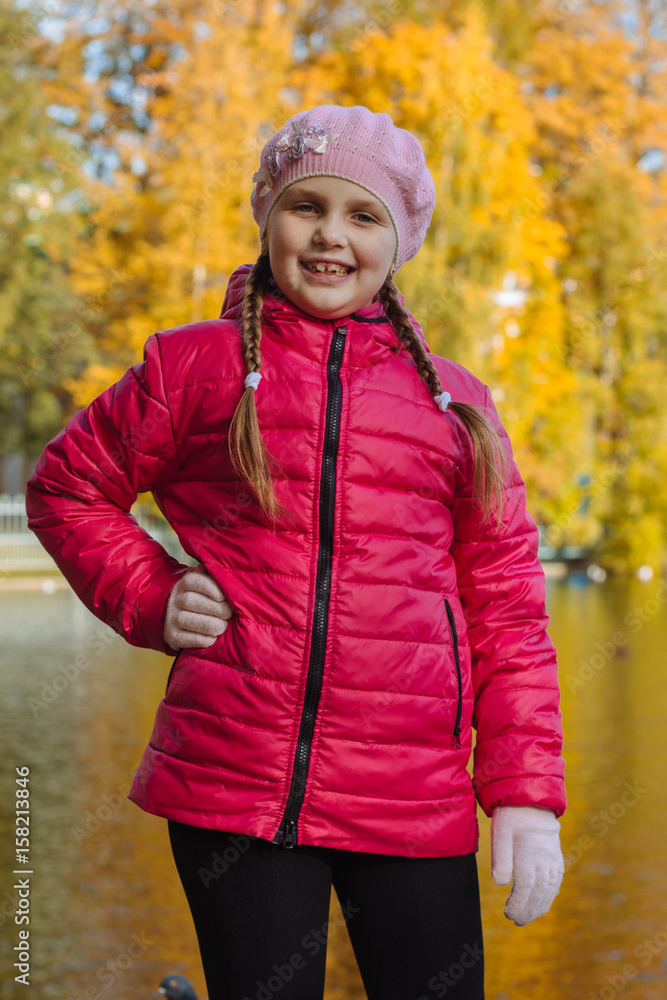 Happy little child, baby girl laughing and playing in the autumn on the nature walk outdoors Happy little child, baby girl laughing and playing in the autumn on the nature walk outdoors