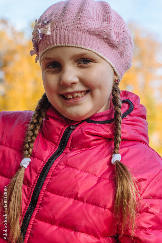 Happy little child, baby girl laughing and playing in the autumn on the nature walk outdoors Happy little child, baby girl laughing and playing in the autumn on the nature walk outdoors