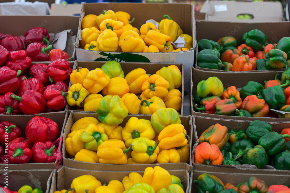 Bulgarian pepper of different varieties in the boxes on the market