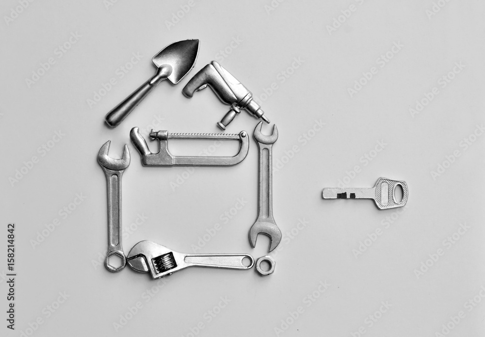 house of toy building tools on gray background house of toy building tools on gray background