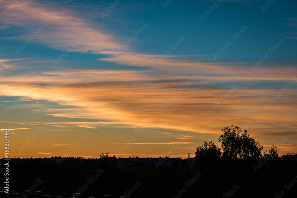 abstract colored sunset sky with broken clouds abstract colored sunset sky with broken clouds