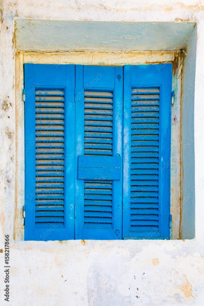 Closed blue window shutters