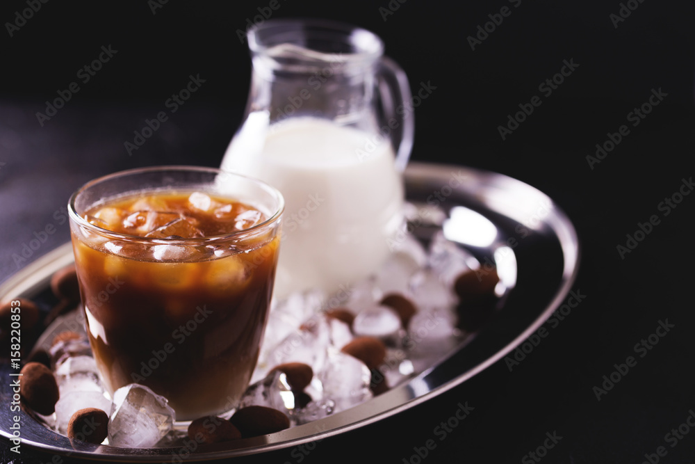 Iced coffee with milk and chocolate truffles in glasses Iced coffee with milk and chocolate truffles in glasses