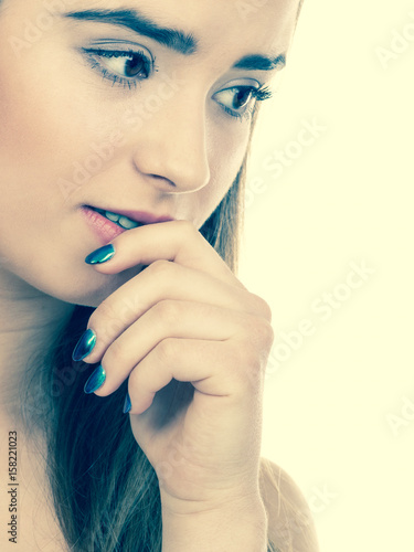 Teenage woman looking worried  thinking about something