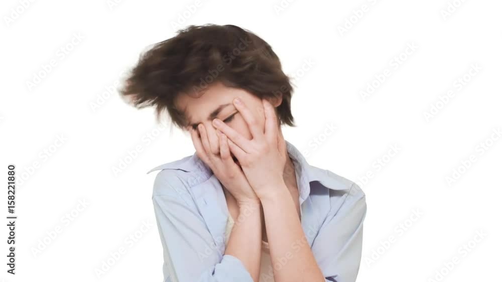 Beautiful young Caucasian girl shaking hear head actively in despair. Footage on white background in slowmotion Beautiful young Caucasian girl shaking hear head actively in despair. Footage on white background in slowmotion