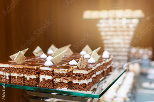 sweet buffet - chocolate cakes, souffle and Swiss rolls, catering