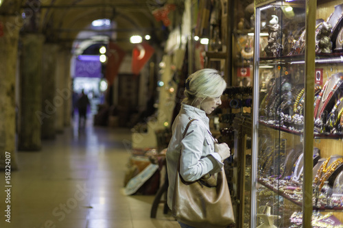 Photography Middle aged woman in storefront shopping in Grand Bazaar,Istanbul