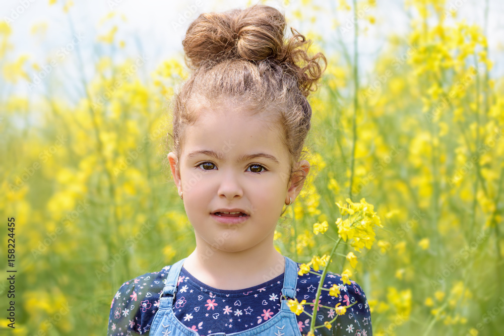 Lovely sweet girl happy beautiful woman on blooming rapeseed field in spring Lovely sweet girl happy beautiful woman on blooming rapeseed field in spring