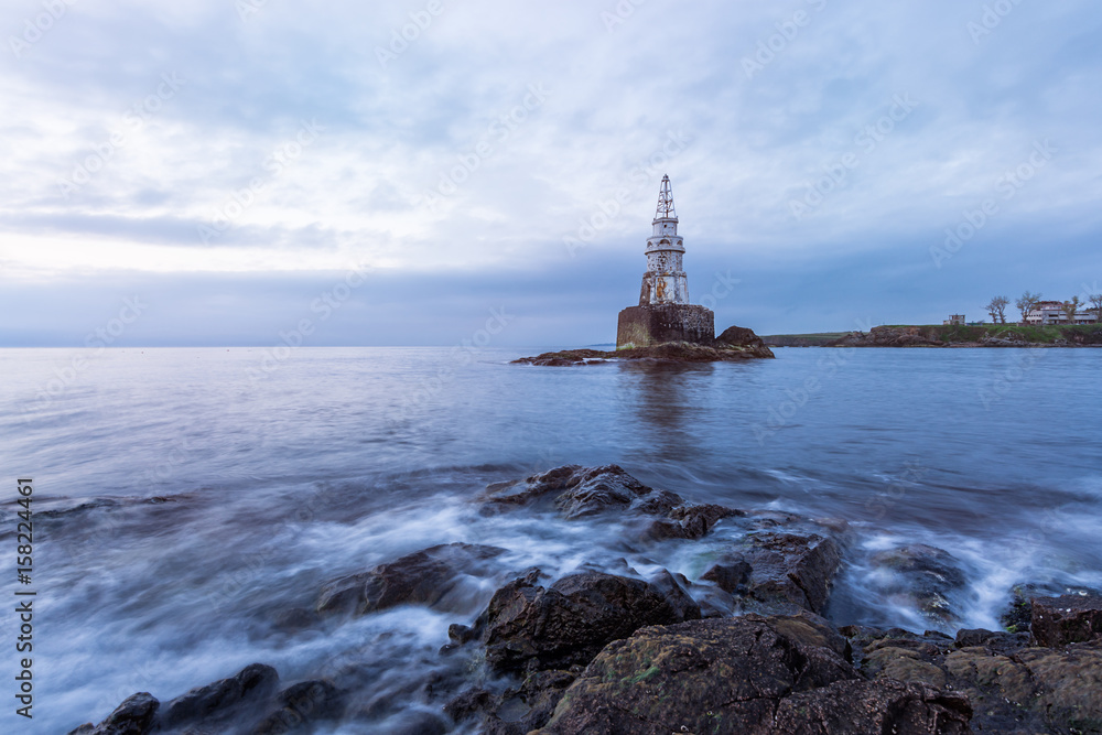 Beautiful Sunrise at Old lighthouse in the port of Ahtopol, Black sea, Bulgaria