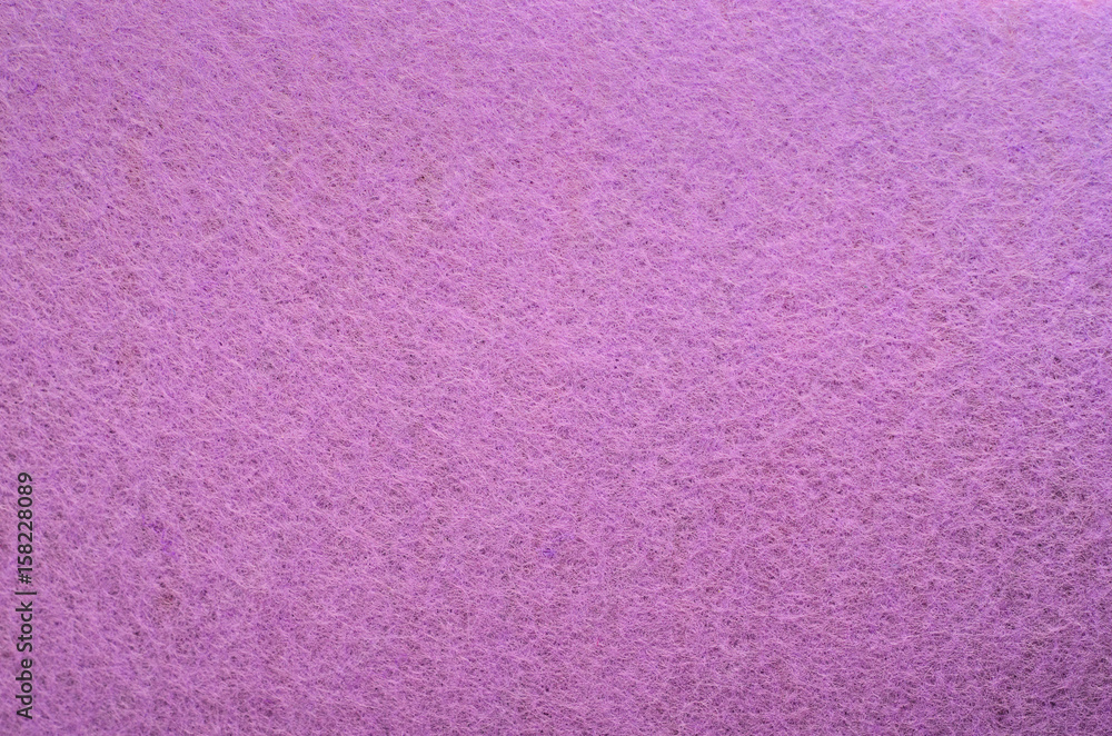 Fototapeta premium Purple Color Felt Texture Background. Fiber texture of felt close-up