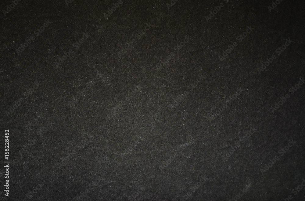 Black graphite texture of cardboard. Rough surface for background