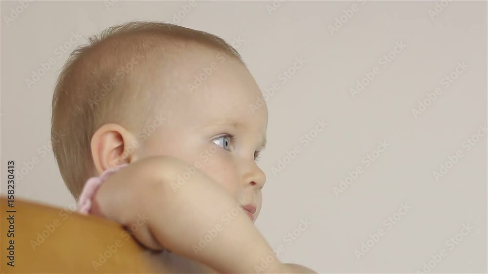 Portrait of a little baby girl in profile. Close-up. Portrait of a little baby girl in profile. Close-up.