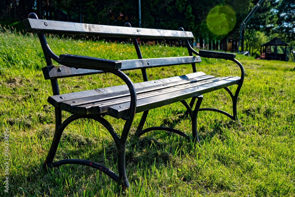 Park bench on the edge of a way Park bench on the edge of a way