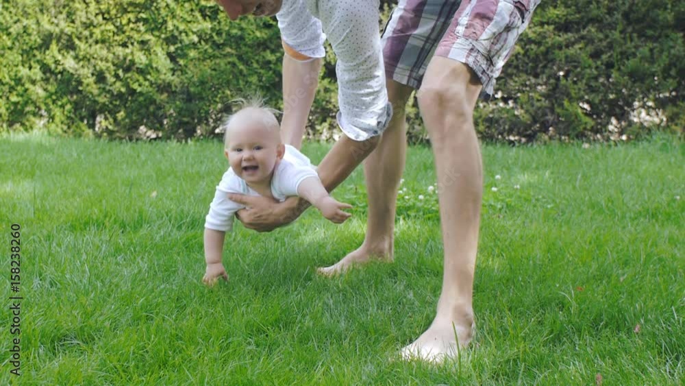 Dad and baby having fun in spring park Dad and baby having fun in spring park