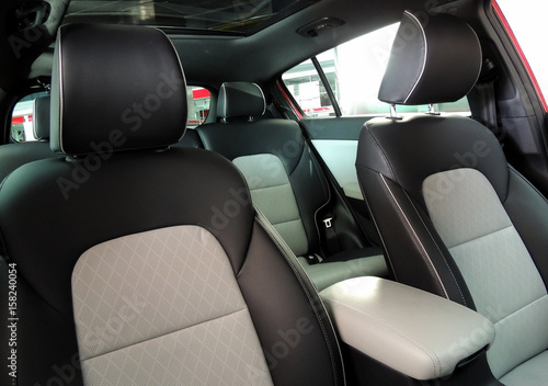 Driver and passengers seats under panoramic roof inside the vehicle at showroom   © AnyVIDStudio