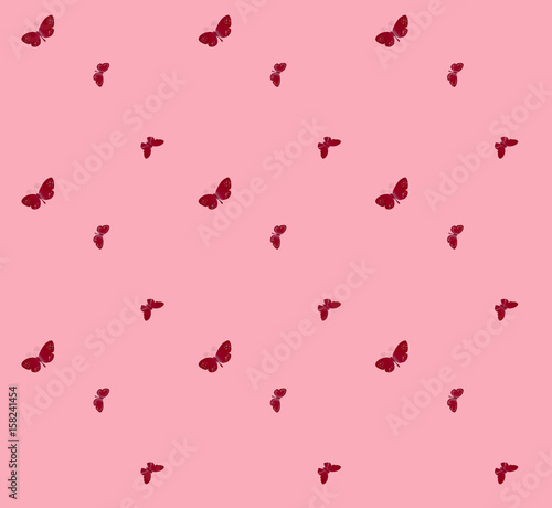 Red butterfly on pink wall background