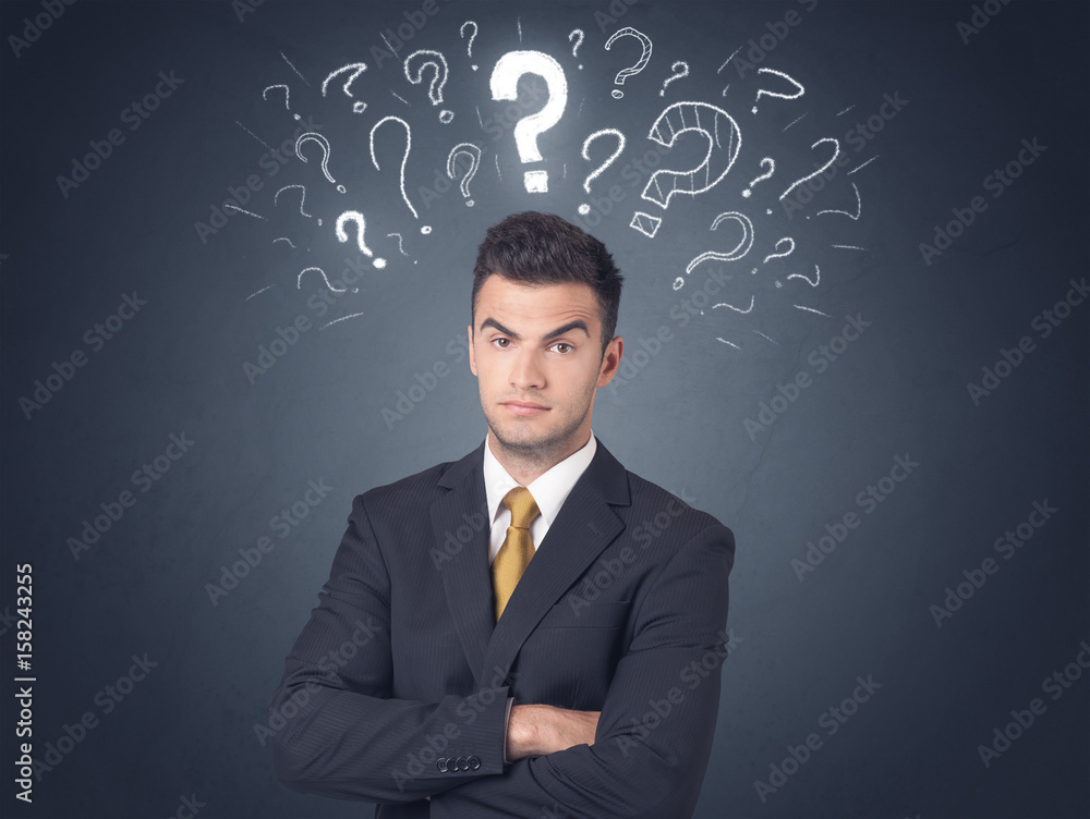 Businessman with question marks