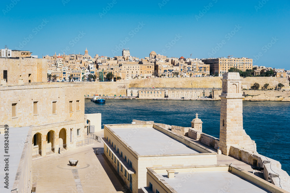 Valletta city walls as seen from Birgu (Vittoriosa) with bastioned Fort Saint Angelo in the foreground, Malta