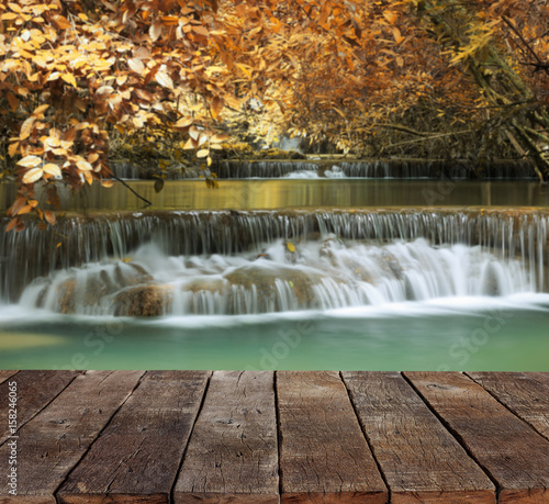 wood floor and beauty waterfall background
