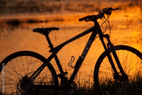 Bicycle on sunset background