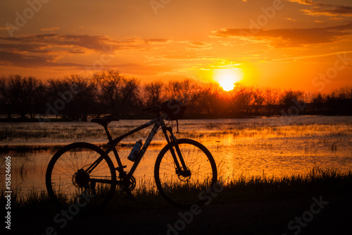Bicycle on sunset background