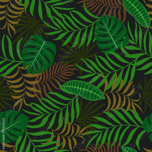 Fototapeta Naklejka Na Ścianę i Meble -  Tropical background with palm leaves. Seamless floral pattern
